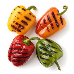 Four grilled bell peppers in different colors isolated on white background