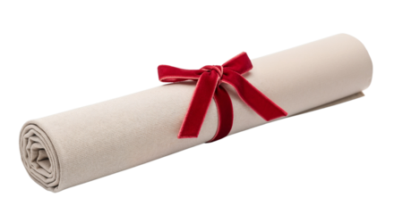 Rolled napkin tied with red ribbon on white background  