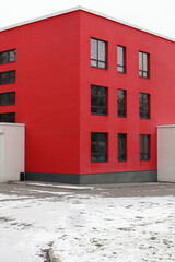 A modern red architectural office building.