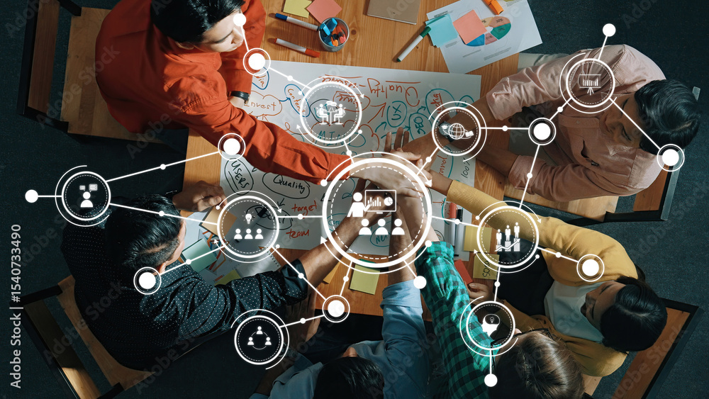 Poster a diverse team engages in a collaborative brainstorming session at a large table, utilizing digital 