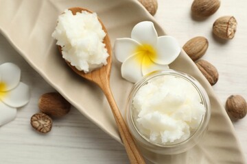 Natural shea butter on white wooden table, flat lay