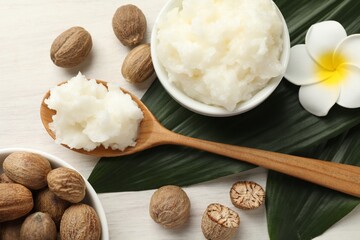 Natural shea butter on white wooden table, flat lay