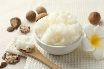 Natural shea butter on white table, closeup