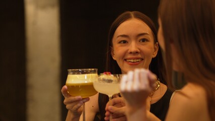 Enjoy drinking beautiful woman mixed vodka cocktails at luxurious counter bar toasting with friends...
