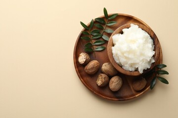 Natural shea butter on beige background, top view. Space for text