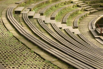 Wooden amphitheater seating and concrete steps outdoors
