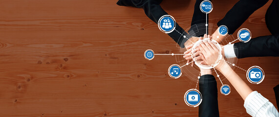 Collaborative Teamwork Concept with Hands Overlaid by Media Icons Representing Communication, Technology, and Social Interaction in Modern Business Environment. Amity