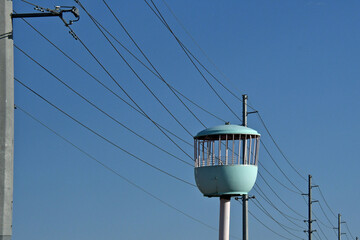 Juxtaposition of power lines and isolated &ldquo;Bird Cage&rdquo; an amusement park remnant lies testament to an project never built