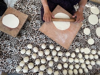 Kneading dough and making bread, top view of rolling bread dough.