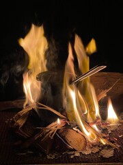 Fire with a coffee pot, warm winter atmosphere.