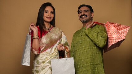 Portraits of young Couple wearing traditional outfits on festival