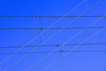 Power line abstract. Jumper cables connect cables going in different directions 
