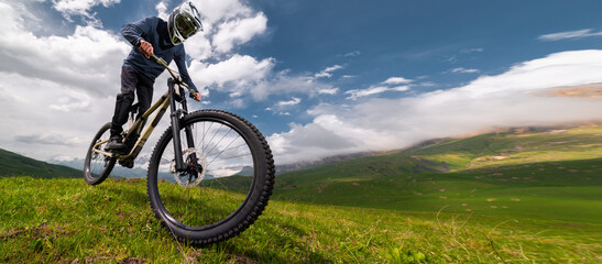 MTB Mountain Bike cyclist riding single track wide angle