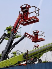 Eyecatching and colorful lifting equipment can be seen at this busy construction site. A vibrant...