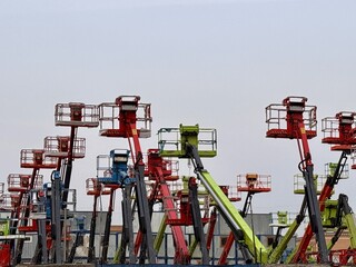 Eyecatching and colorful lifting equipment can be seen at this busy construction site. A vibrant...