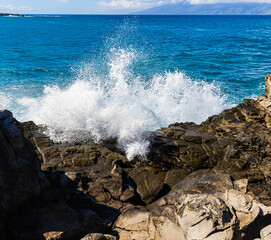 Waves Washing Over The Sea Cliffs on Makaluapuna Point With Molokai Across Pailolo Channel,...