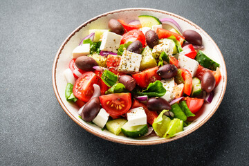 Greek salad, healthy food, mediterranean diet. Fresh vegetables, cheese and olive oil.