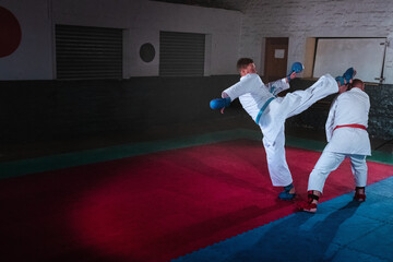 Teenage Boy Practicing Karate with His Father and Instructor
