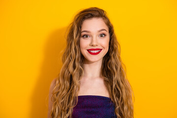 Stylish woman amidst a vivid yellow backdrop wearing trendy attire with her radiant smile and...