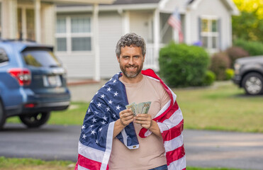 Taxation system. Patriotic man. Man with American flag and dollar money. Inflation concept....