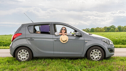 Travel car. Family trip countryside vehicle. Parents daughter outdoor road summer.