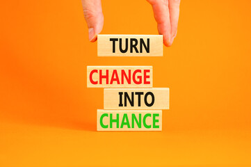 Turn change into chance symbol. Concept words phrase Turn change into chance on beautiful wooden...