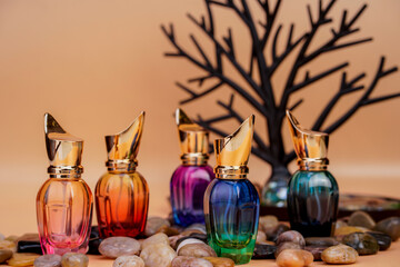 Creative perfume bottle arrangement with colorful reflections and textures.