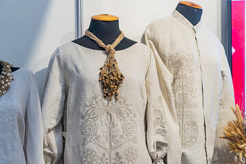 Collection of Ukrainian national dress on mannequins against a white background, featuring...
