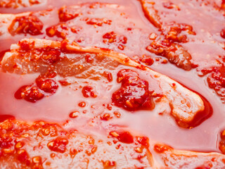 Fine pork chops in rich red juicy marinade. Raw meat product for cooking in many different way....