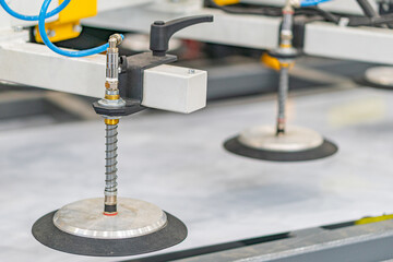 Close-up view of an industrial setting, possibly a manufacturing or assembly area Two round objects...