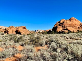 Fototapeta premium Gorgeous Snow Canyon State Park in St. George Utah - view is near red mountain resort. Explore, adventure, hike, spectacular views and amazing lava tubes, hiking trails. Amazing experience in nature.