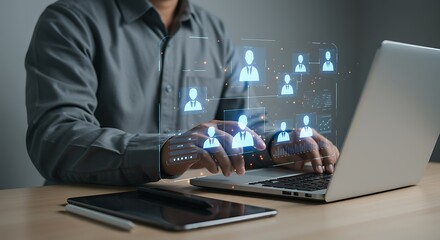 Man using laptop with glowing network icons businessman