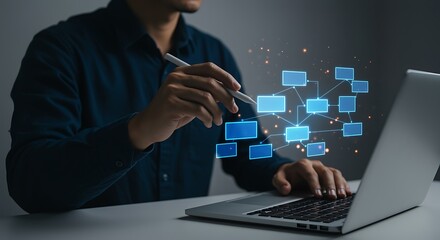 Person using stylus on laptop analyzing blue data flow diagram