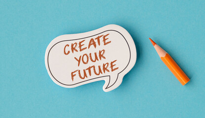 A pencil is on a blue background with the words Create Your Future written on