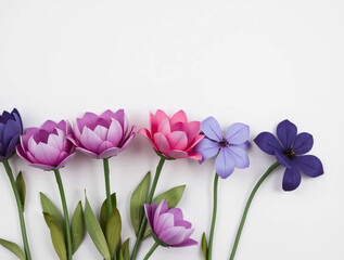 Fototapeta premium Minimalist Flat Lay of Vibrant Flowers in Horizontal Row - Clean White Background Floral Arrangement