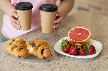Starting the day with fresh coffee, croissants, and juicy strawberries