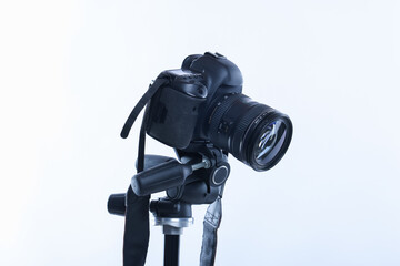 Modern professional video camera on white background