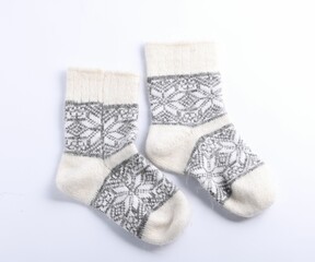 Pair of wool socks isolated on white, top view