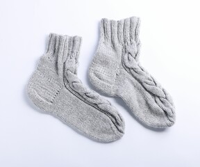 Pair of gray wool socks isolated on white, top view