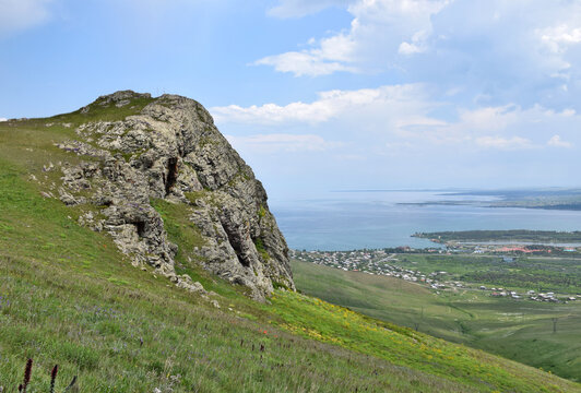 Breathtaking view of Lake Sevan from a hiking trail near the town of Sevan &ndash; a peaceful blend of water, sky, and surrounding mountains.