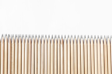 Many graphite pencils on white background, flat lay. Space for text