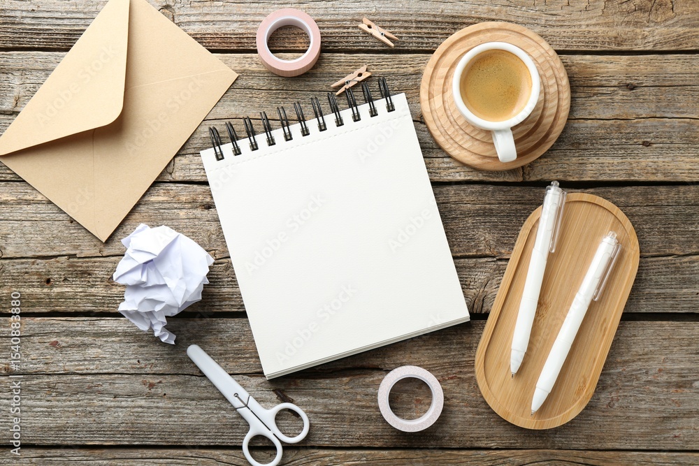 Aufkleber flat lay composition with open blank notebook on wooden table