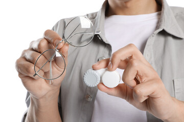 Man with glasses and contact lenses on white background, closeup