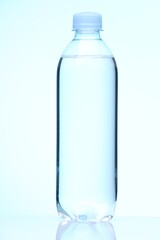 Plastic bottle with clean water on white background