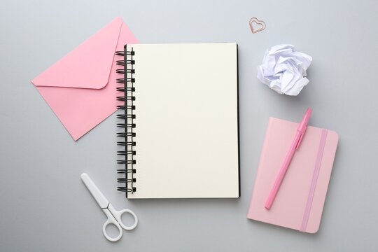 Flat lay composition with notebooks on gray background