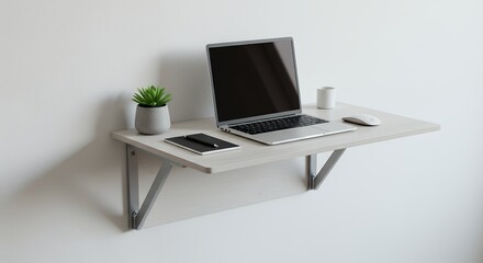 Light gray wall mounted desk with laptop