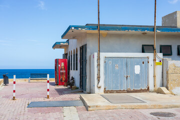 Marsaskala, Malta - 05.12.2025: An old abandoned service building in the middle of nowhere,...