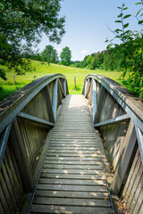 Obraz premium Wood and tell Bridges over the Mitternacher Ohe River in the bavarian Forests Germany.