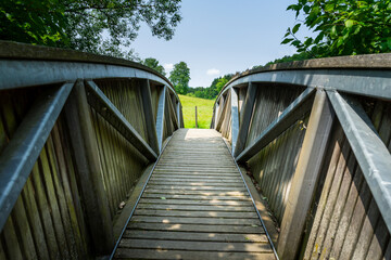 Wood and tell Bridges over the Mitternacher Ohe River in the bavarian Forests Germany.