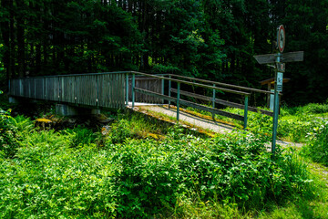 Wood and tell Bridges over the Mitternacher Ohe River in the bavarian Forests Germany.